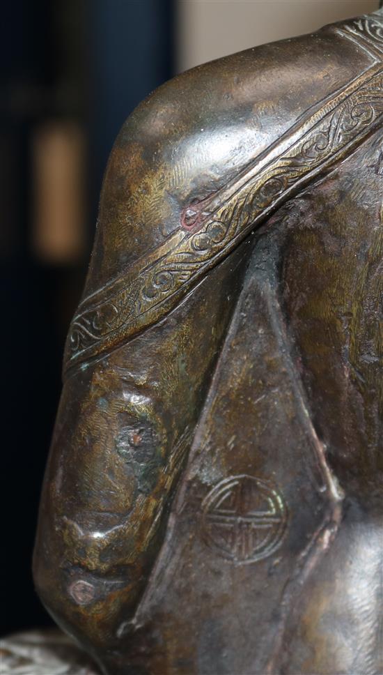 A large Tibetan bronze seated figure of Buddha Shakyamuni, probably 13th century, height 39.5cm, minor old repairs